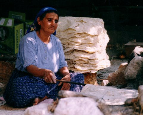 villager turning the bread
